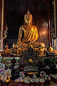 Chiang Mai - The Wat Phan Tao temple. The Buddha statue of the main altar of the Wihan. 